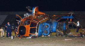 Wind knocks over helicopter, 1 dead, 2 injured